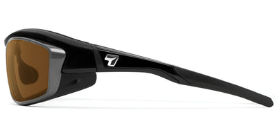 Side view of 7eye Rocker Sunglasses featuring a black frame, brown shatter-resistant lenses with UVA/UVB protection, and a logo on the temple. Ideal for medium to large face sizes.