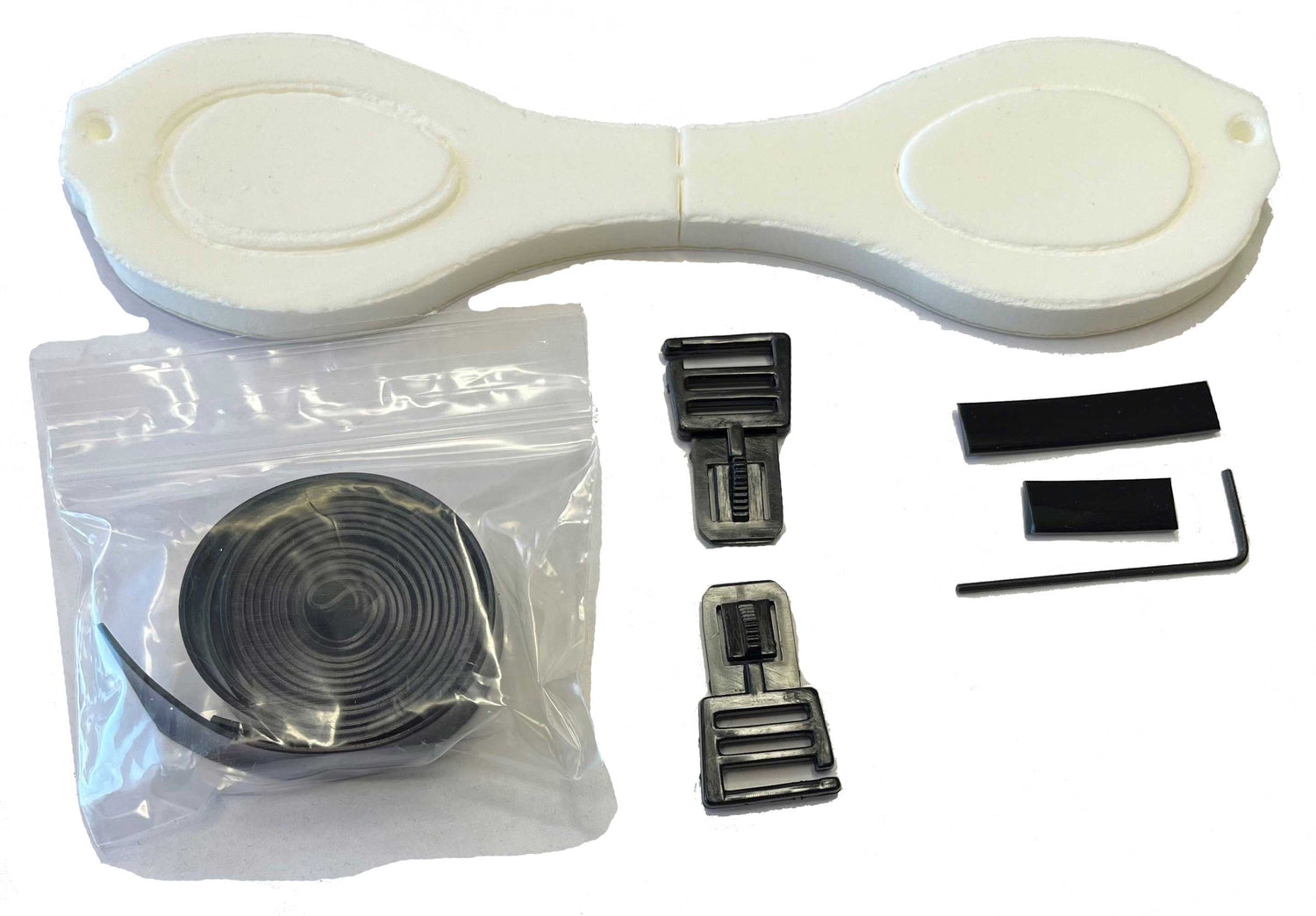 The Repair Kit - Barracuda B300 by Barracuda, including foam pads, plastic buckles, tape, and a hex key, is laid out on a white background for easy goggle repairs. The Repair Kit - Barracuda B300 by Barracuda, including foam pads, plastic buckles, tape, and a hex key, is laid out on a white background for easy goggle repairs.