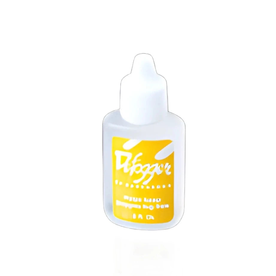 The Barracuda Defogger - Original bottle, a small white bottle featuring a yellow label and dropper cap, is ideal for keeping your lenses fog-free or improving the clarity of your Comfort Series goggles. The Barracuda Defogger - Original bottle, a small white bottle featuring a yellow label and dropper cap, is ideal for keeping your lenses fog-free or improving the clarity of your Comfort Series goggles.