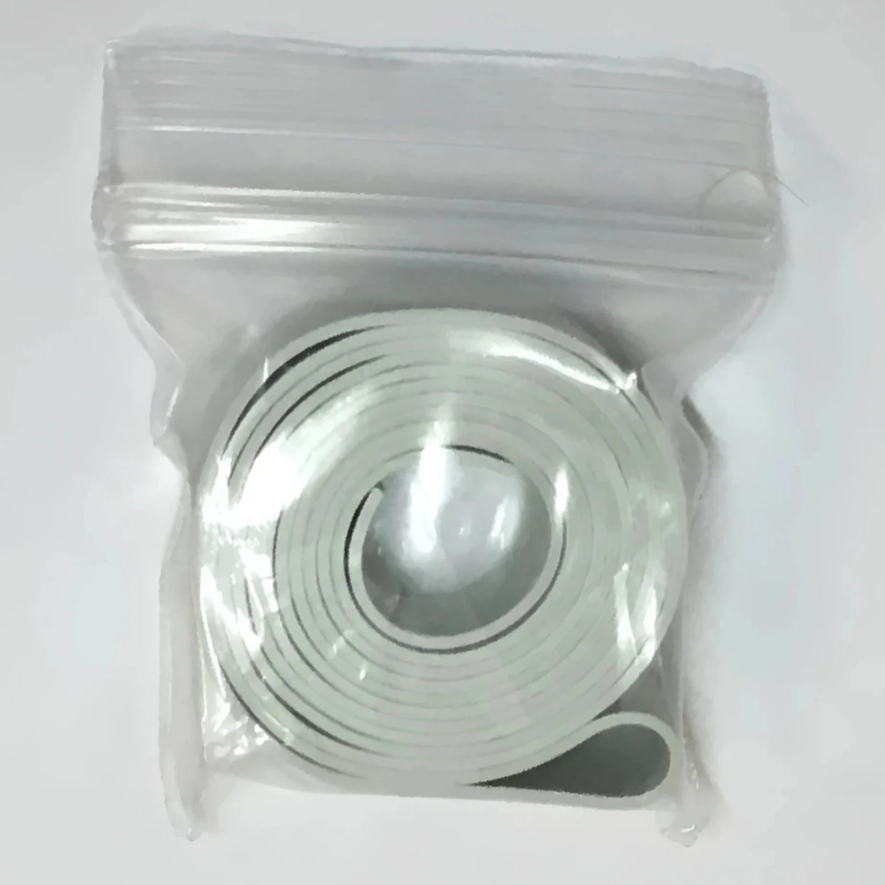 The Barracuda Replacement Strap by Barracuda is a white adhesive tape in a clear resealable bag, ideal for securing goggles or using as a replacement strap. The Barracuda Replacement Strap by Barracuda is a white adhesive tape in a clear resealable bag, ideal for securing goggles or using as a replacement strap.