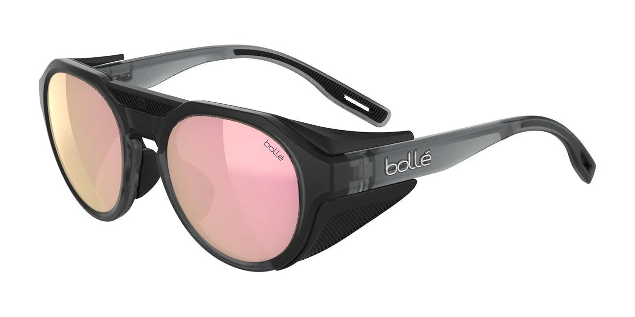 Bolle ASCENDER Sunglasses in Grey Frost II, size 51, feature pink-tinted Solace4 lenses and removable side shields on the temples. Bolle ASCENDER Sunglasses in Grey Frost II, size 51, feature pink-tinted Solace4 lenses and removable side shields on the temples.