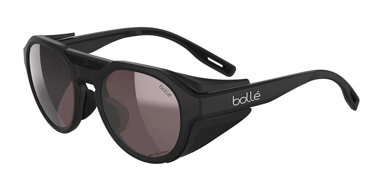 Black Matte II Bolle ASCENDER Sunglasses (Size 51) feature removable side shields and tinted Solace4 lenses, ideal for outdoor or sports use. Black Matte II Bolle ASCENDER Sunglasses (Size 51) feature removable side shields and tinted Solace4 lenses, ideal for outdoor or sports use.