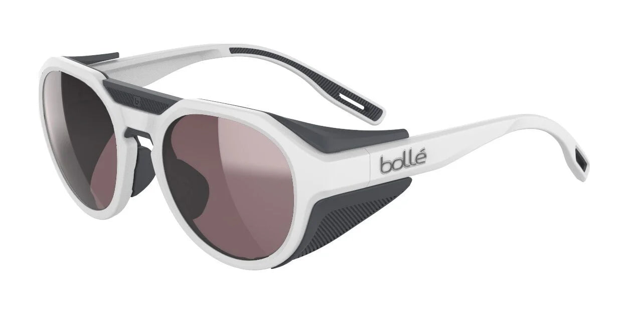 White matte Bolle ASCENDER Sunglasses | Size 51 with round, tinted photochromic lenses and removable side shields. White matte Bolle ASCENDER Sunglasses | Size 51 with round, tinted photochromic lenses and removable side shields.
