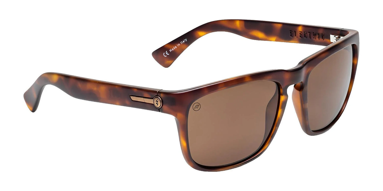 Electric Knoxville XL Sunglasses | Size 61 by Electric feature brown tortoiseshell square frames and brown tinted lenses for superior sun protection and lightweight comfort, shown on a white background. Electric Knoxville XL Sunglasses | Size 61 by Electric feature brown tortoiseshell square frames and brown tinted lenses for superior sun protection and lightweight comfort, shown on a white background.