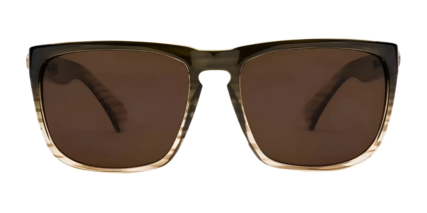 Electric Knoxville XL Sunglasses by Electric feature thick brown gradient frames, dark lenses, and a lightweight fit for superior sun protection. Shown on a white background. Size 61. Electric Knoxville XL Sunglasses by Electric feature thick brown gradient frames, dark lenses, and a lightweight fit for superior sun protection. Shown on a white background. Size 61.