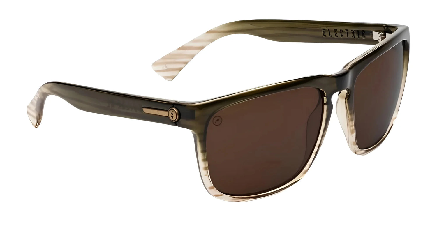 The Electric Knoxville XL Sunglasses | Size 61 feature brown lenses and transparent brown and beige striped plastic frames, offering a lightweight fit and superior sun protection. The Electric Knoxville XL Sunglasses | Size 61 feature brown lenses and transparent brown and beige striped plastic frames, offering a lightweight fit and superior sun protection.