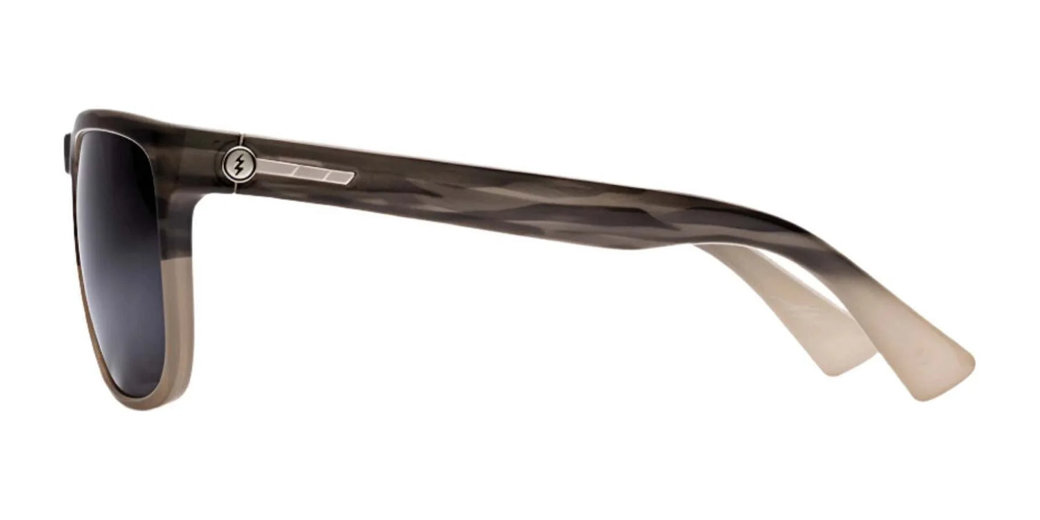 Side view of Electric Knoxville XL Sunglasses | Size 61 by Electric, featuring a camouflage pattern, dark lenses for top sun protection, and a silver arm accent in a lightweight frame. Side view of Electric Knoxville XL Sunglasses | Size 61 by Electric, featuring a camouflage pattern, dark lenses for top sun protection, and a silver arm accent in a lightweight frame.