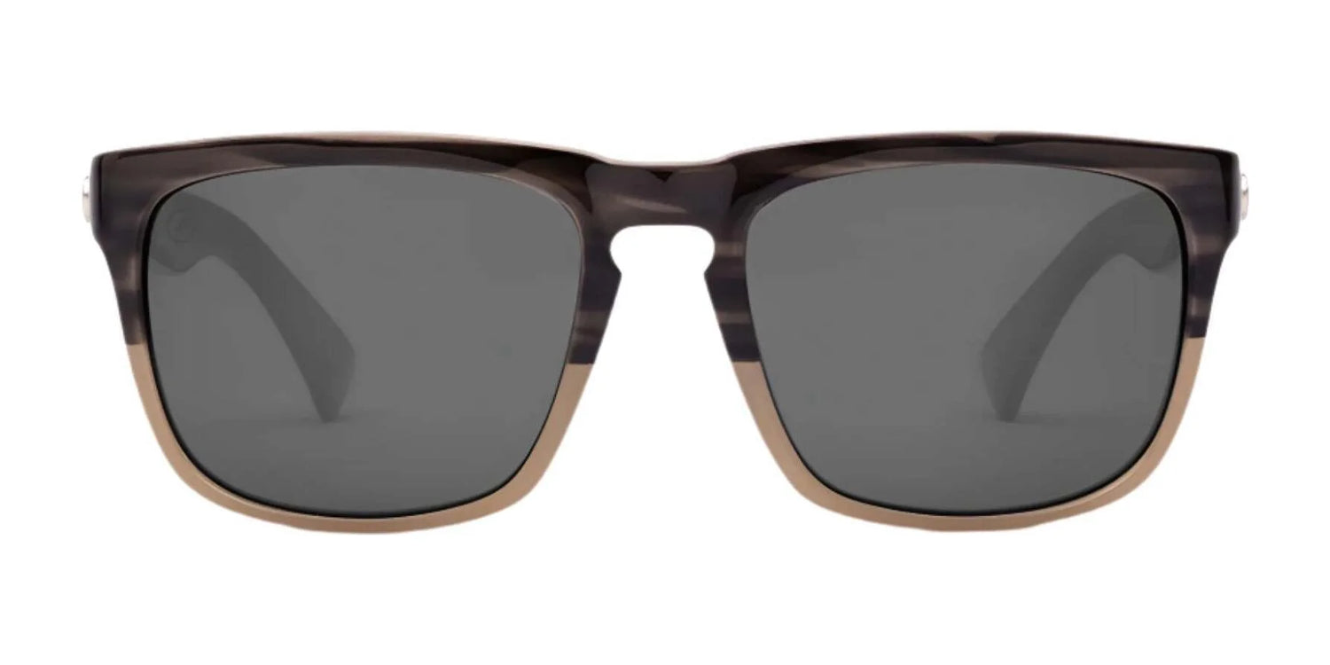Electric Knoxville XL Sunglasses | Size 61 by Electric feature dark lenses and a brown and beige two-tone frame, offering a lightweight fit and superior sun protection, shown from the front. Electric Knoxville XL Sunglasses | Size 61 by Electric feature dark lenses and a brown and beige two-tone frame, offering a lightweight fit and superior sun protection, shown from the front.