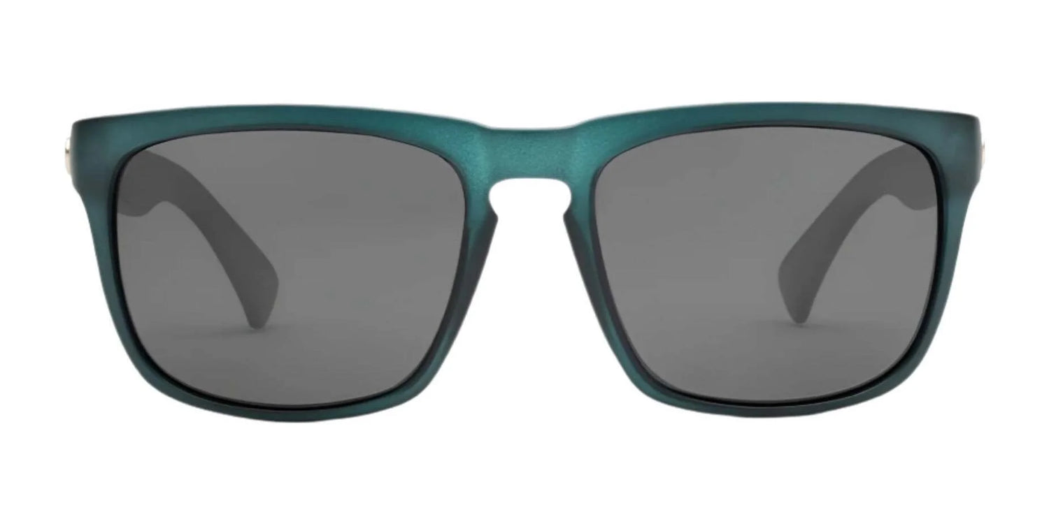 The Electric Knoxville XL Sunglasses | Size 61 feature a teal rectangular frame with dark lenses, shown front-facing on a white background. Lightweight and stylish, they offer superior sun protection from Electric. The Electric Knoxville XL Sunglasses | Size 61 feature a teal rectangular frame with dark lenses, shown front-facing on a white background. Lightweight and stylish, they offer superior sun protection from Electric.
