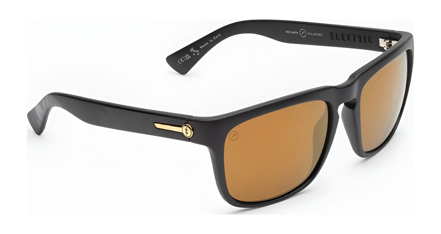 Electric Knoxville XL Sunglasses | Size 61 by Electric in black with brown lenses and gold accents on the arms, provide superior sun protection and lightweight comfort. Shown on a white background. Electric Knoxville XL Sunglasses | Size 61 by Electric in black with brown lenses and gold accents on the arms, provide superior sun protection and lightweight comfort. Shown on a white background.