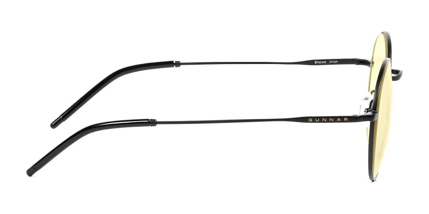 Side view of Gunnar Ellipse Computer Glasses with black frames and yellow-tinted lenses featuring a blue light filter. Made with a sleek stainless-steel frame, they display "GUNNAR" and model details on the temples, offering a panoramic viewing field. Side view of Gunnar Ellipse Computer Glasses with black frames and yellow-tinted lenses featuring a blue light filter. Made with a sleek stainless-steel frame, they display "GUNNAR" and model details on the temples, offering a panoramic viewing field.