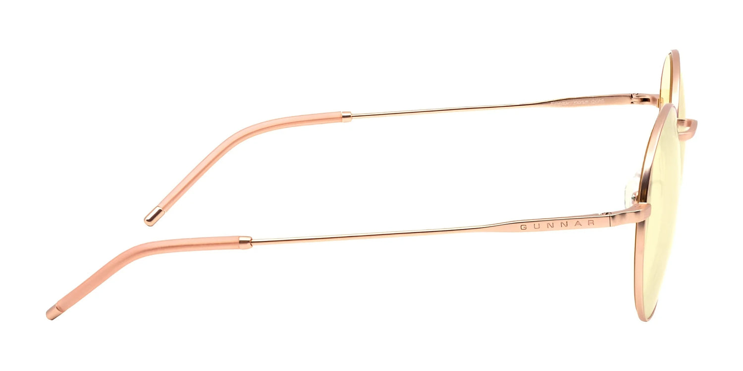 Side view of Gunnar Ellipse Computer Glasses in rose gold, featuring a thin, stainless-steel frame and yellow-tinted lenses on a white background, offering a panoramic viewing field. Side view of Gunnar Ellipse Computer Glasses in rose gold, featuring a thin, stainless-steel frame and yellow-tinted lenses on a white background, offering a panoramic viewing field.