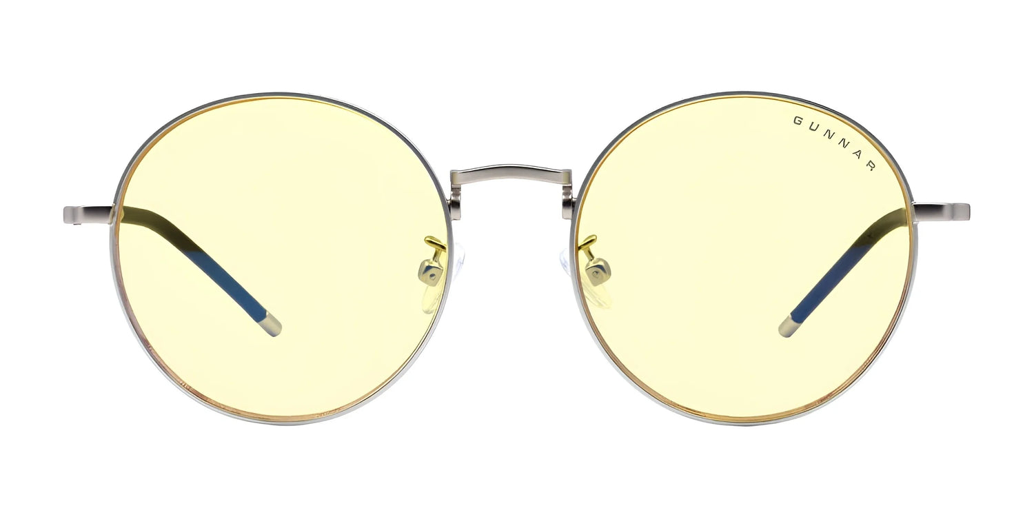 Gunnar Ellipse Computer Glasses | Size 51 feature round, stainless-steel frames with yellow-tinted lenses and "GUNNAR" on the upper right lens. Their design includes the ELLIPSE blue light filter for enhanced eye comfort during panoramic viewing. Gunnar Ellipse Computer Glasses | Size 51 feature round, stainless-steel frames with yellow-tinted lenses and "GUNNAR" on the upper right lens. Their design includes the ELLIPSE blue light filter for enhanced eye comfort during panoramic viewing.