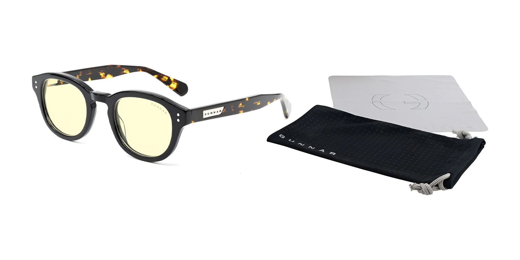 The Gunnar Emery Computer Glasses, size 47, feature black frames with yellow-tinted, anti-reflective lenses and come with a sleek black pouch and a silver cleaning cloth. The Gunnar Emery Computer Glasses, size 47, feature black frames with yellow-tinted, anti-reflective lenses and come with a sleek black pouch and a silver cleaning cloth.