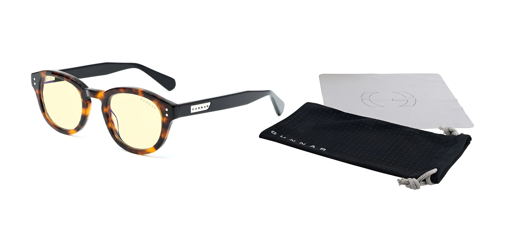 Gunnar Emery Computer Glasses, featuring a premium tortoiseshell frame and yellow lenses, offer style and comfort. They include a black branded pouch and gray cloth on a white background. Gunnar Emery Computer Glasses, featuring a premium tortoiseshell frame and yellow lenses, offer style and comfort. They include a black branded pouch and gray cloth on a white background.