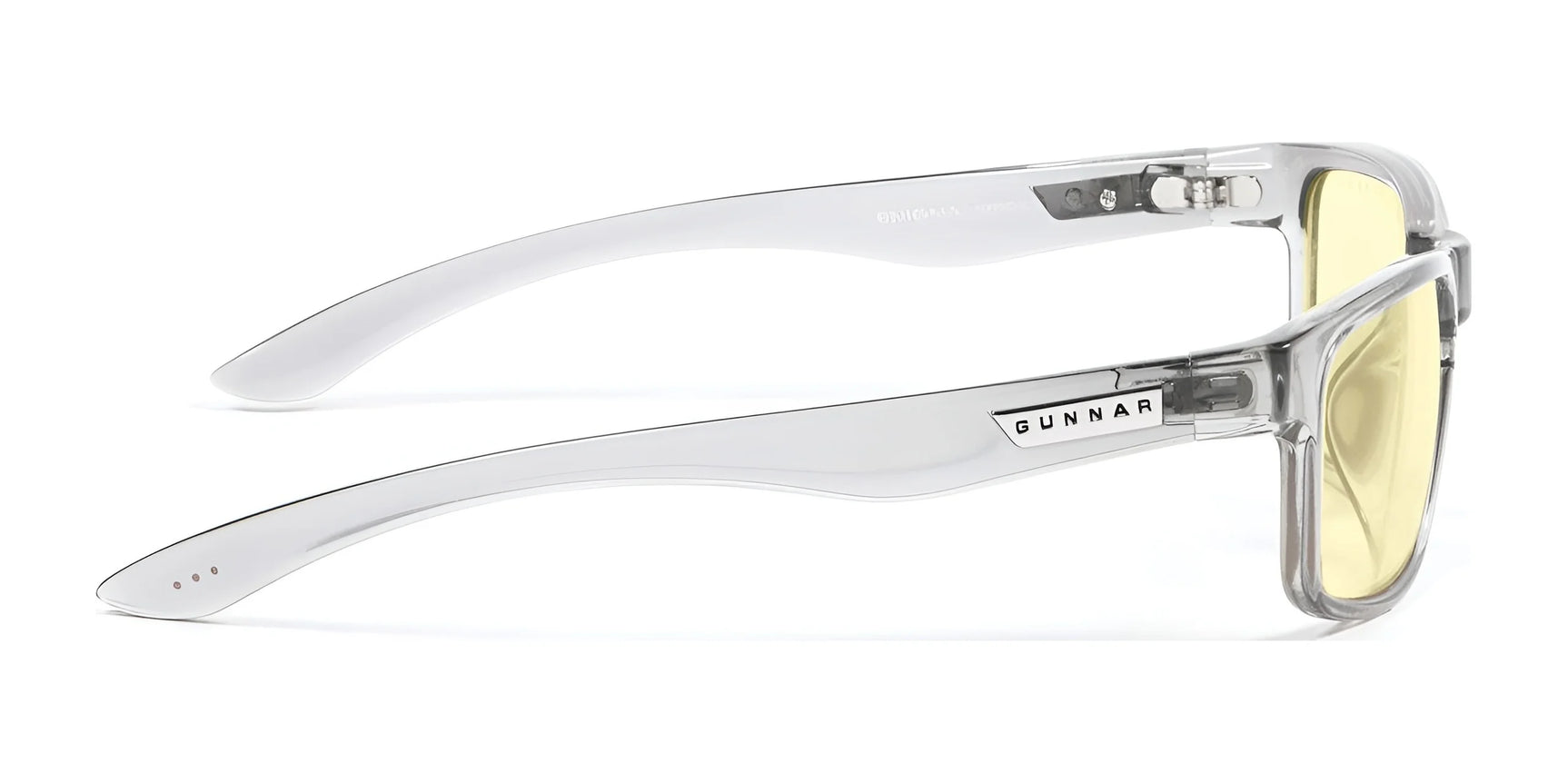 Gunnar’s Enigma Computer Glasses | Size 58 feature clear frames with yellow-tinted lenses, branded arms, and are designed for gaming. Perfectly showcased from the side, these glasses block blue light to protect your eyes during extended screen time. Gunnar’s Enigma Computer Glasses | Size 58 feature clear frames with yellow-tinted lenses, branded arms, and are designed for gaming. Perfectly showcased from the side, these glasses block blue light to protect your eyes during extended screen time.