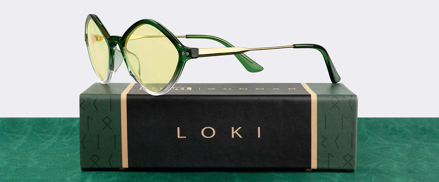 Green-tinted Gunnar Loki Asgard Edition Computer Glasses, size 53, elegantly feature gold accents on a box labeled "LOKI." With precision-engineered polymer and G-Shield™ Plus coating, these glasses offer ultimate durability. Green-tinted Gunnar Loki Asgard Edition Computer Glasses, size 53, elegantly feature gold accents on a box labeled "LOKI." With precision-engineered polymer and G-Shield™ Plus coating, these glasses offer ultimate durability.