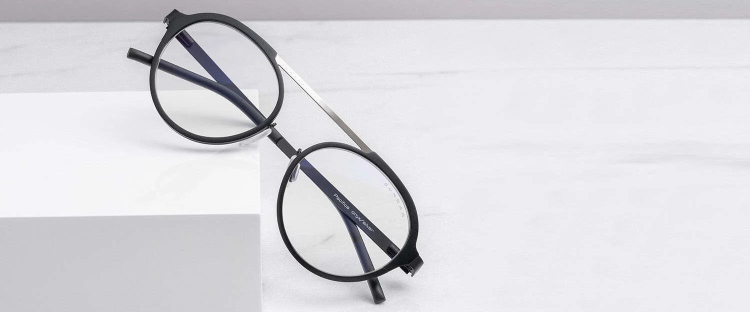 Gunnar Pacifica Computer Glasses, featuring a minimalist round black frame design, rest elegantly on a white surface. Gunnar Pacifica Computer Glasses, featuring a minimalist round black frame design, rest elegantly on a white surface.