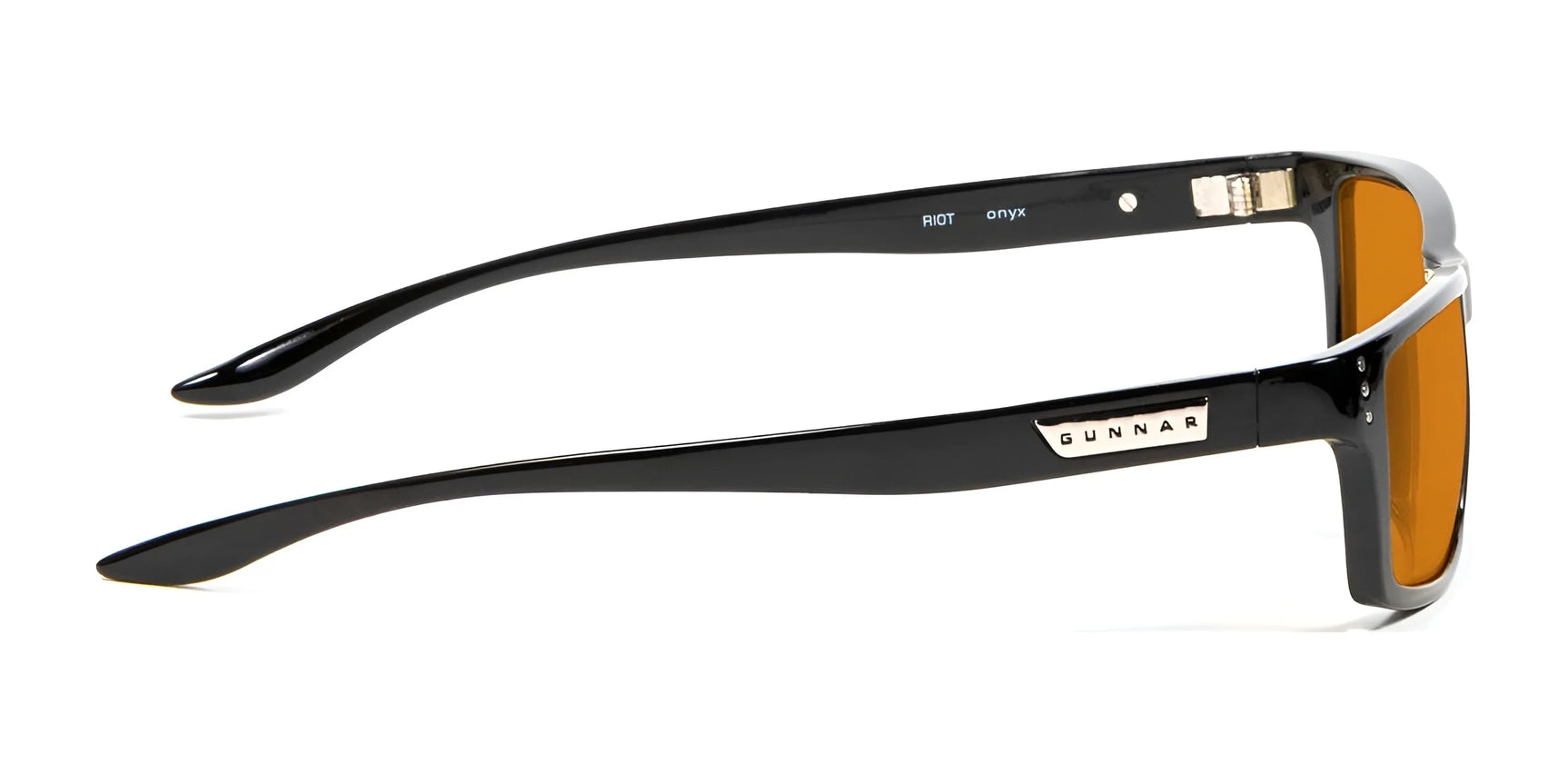 The Gunnar Riot Computer Glasses boast black frames with amber lenses, featuring advanced GUNNAR lens technology for top-tier blue light protection and the "GUNNAR" branding elegantly displayed on the temple. The Gunnar Riot Computer Glasses boast black frames with amber lenses, featuring advanced GUNNAR lens technology for top-tier blue light protection and the "GUNNAR" branding elegantly displayed on the temple.