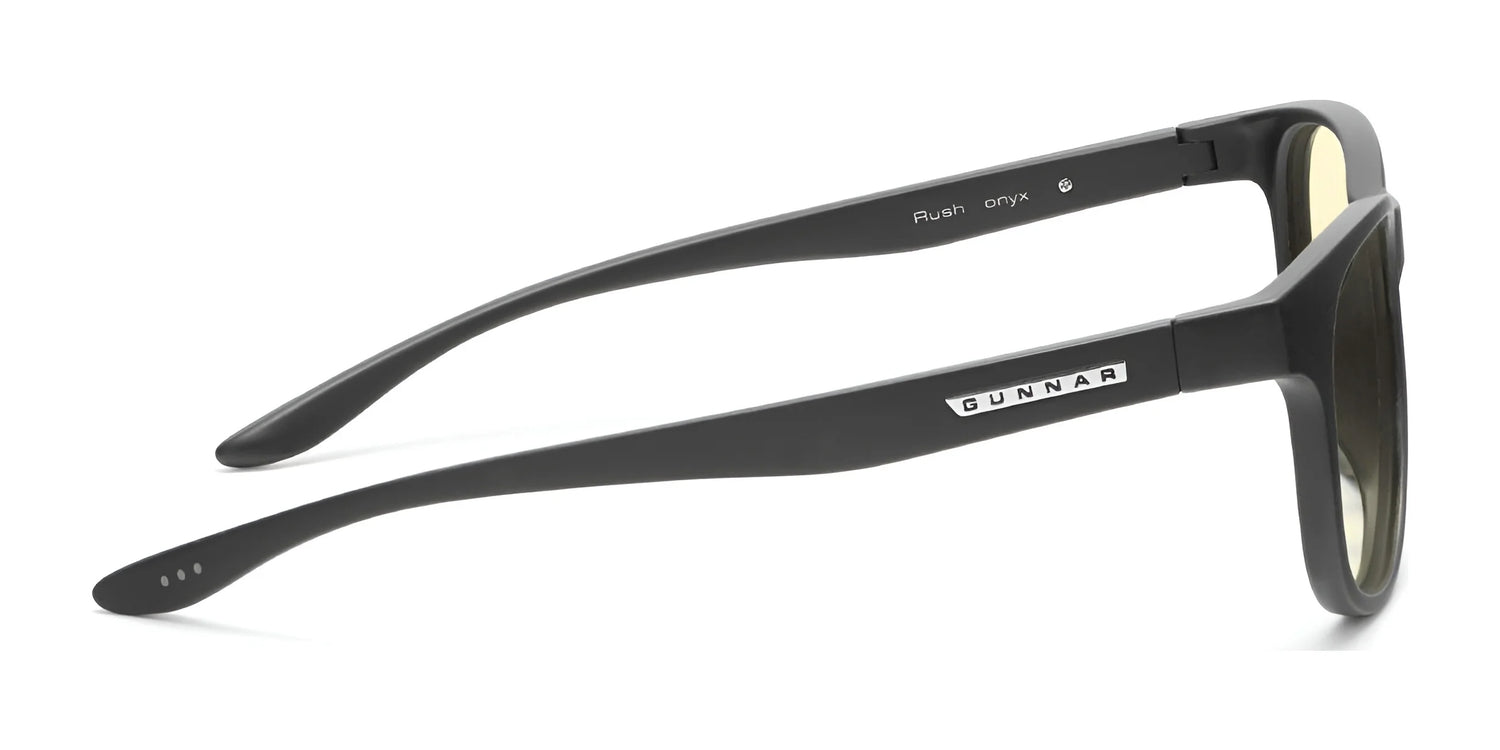 Side view of black Gunnar Rush Computer Glasses, featuring yellow-tinted blue light blocking lenses for kids and teens, with the "Gunnar" label on the temple. Size 53. Side view of black Gunnar Rush Computer Glasses, featuring yellow-tinted blue light blocking lenses for kids and teens, with the "Gunnar" label on the temple. Size 53.