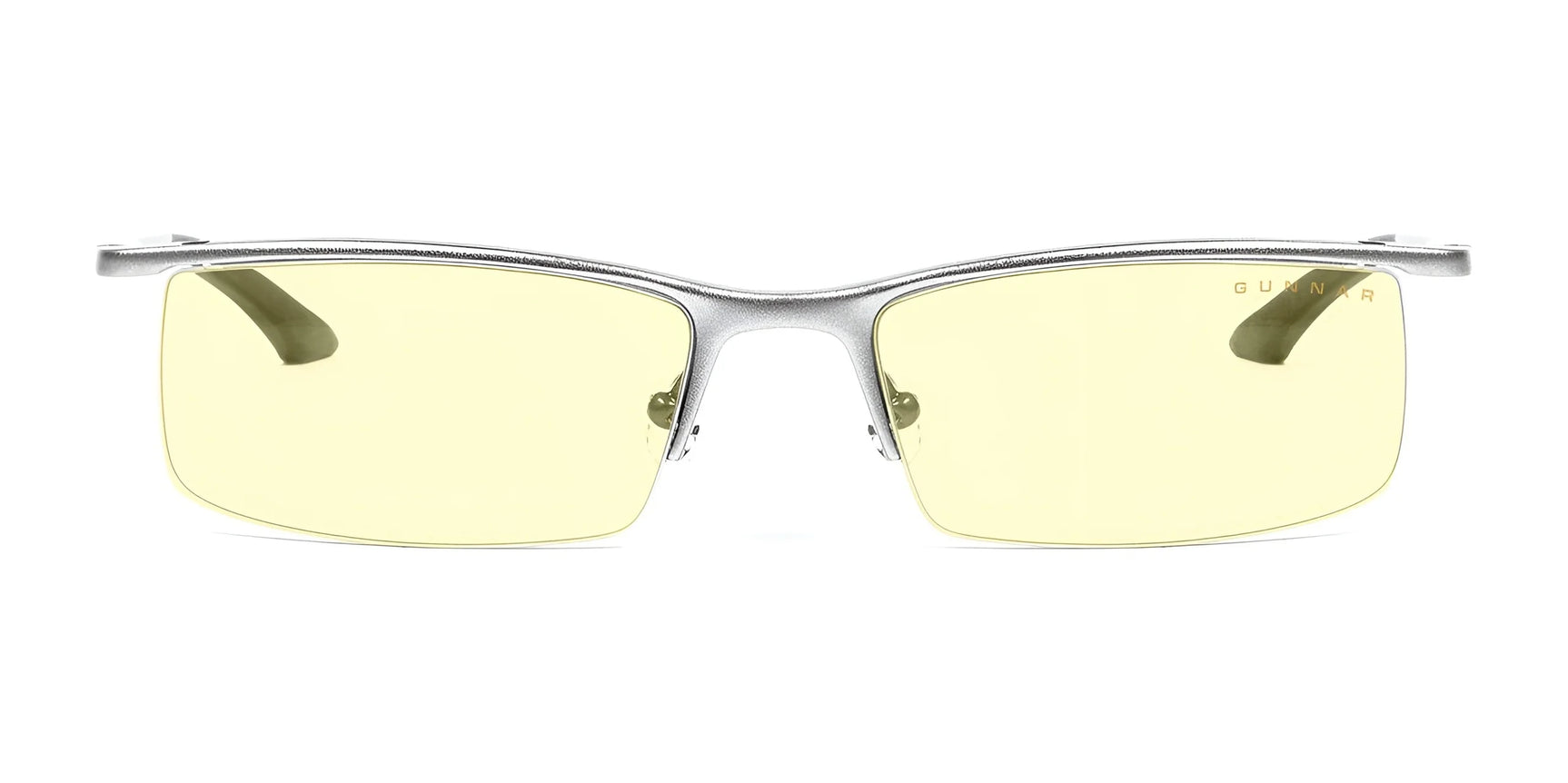 The Gunnar Emissary Computer Glasses, size 55, feature a silver frame and yellow-tinted blue light blocking lenses, shown from a front view. The Gunnar Emissary Computer Glasses, size 55, feature a silver frame and yellow-tinted blue light blocking lenses, shown from a front view.