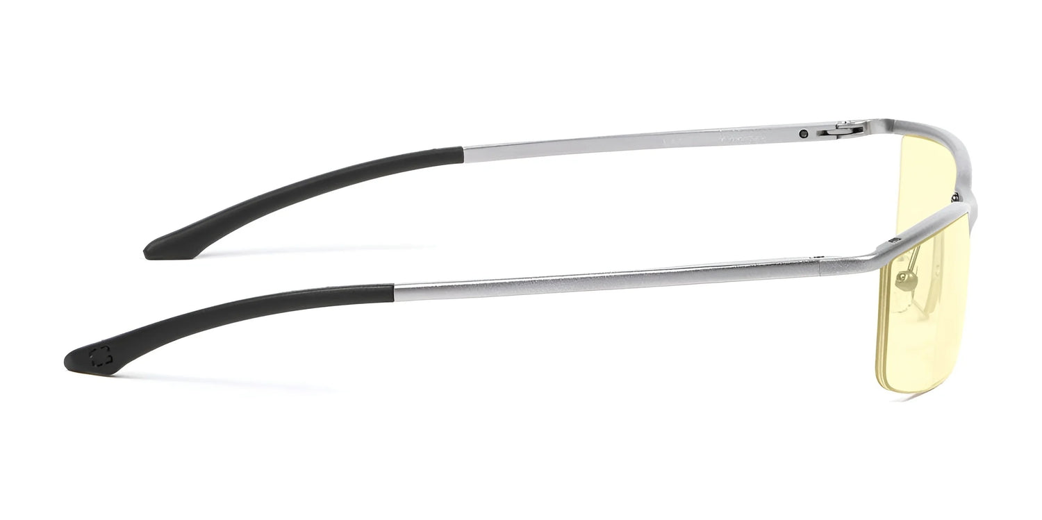 The Gunnar Emissary Computer Glasses, size 55, feature a silver frame with black temple tips and slim, rectangular yellow-tinted lenses. These glasses offer blue light blocking with anti-reflective lenses for comfort and style while protecting your eyes. The Gunnar Emissary Computer Glasses, size 55, feature a silver frame with black temple tips and slim, rectangular yellow-tinted lenses. These glasses offer blue light blocking with anti-reflective lenses for comfort and style while protecting your eyes.