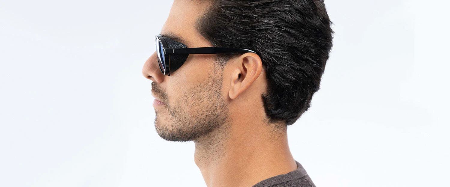 A profile of a person with dark hair wearing Gunnar Tallac Sunglasses, Size 57, set against a light background. A profile of a person with dark hair wearing Gunnar Tallac Sunglasses, Size 57, set against a light background.