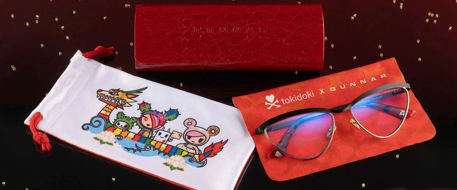 Gunnar Tokidoki Year of the Dragon Computer Glasses (Size 52) with colorful red and black frames come with a Tokidoki dragon-themed cloth bag and a red embossed case. Gunnar Tokidoki Year of the Dragon Computer Glasses (Size 52) with colorful red and black frames come with a Tokidoki dragon-themed cloth bag and a red embossed case.