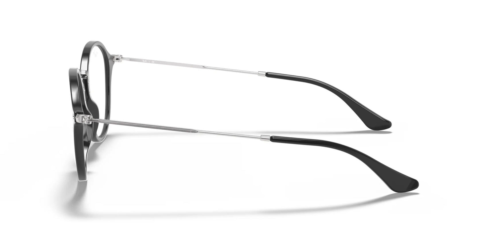 Side view of the classic Ray-Ban ROUND RX2447V Eyeglasses, featuring black round lenses with metal arms and black temple tips, set against a white background. Side view of the classic Ray-Ban ROUND RX2447V Eyeglasses, featuring black round lenses with metal arms and black temple tips, set against a white background.