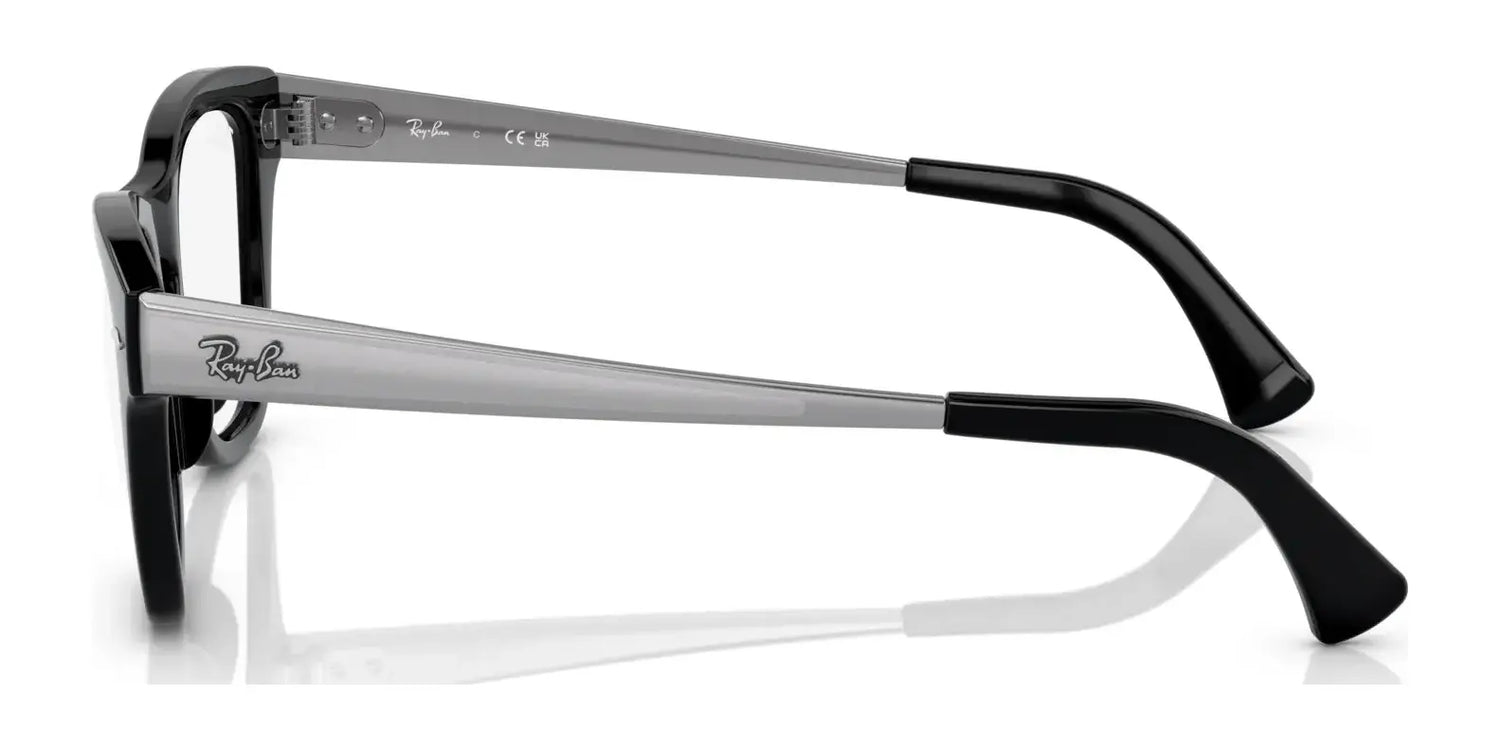 A side view of the Ray-Ban RX0707VM eyeglasses highlights their distinctive and iconic design in black and gray, featuring the brand's signature logo on the temple for an added touch of elegance. A side view of the Ray-Ban RX0707VM eyeglasses highlights their distinctive and iconic design in black and gray, featuring the brand's signature logo on the temple for an added touch of elegance.