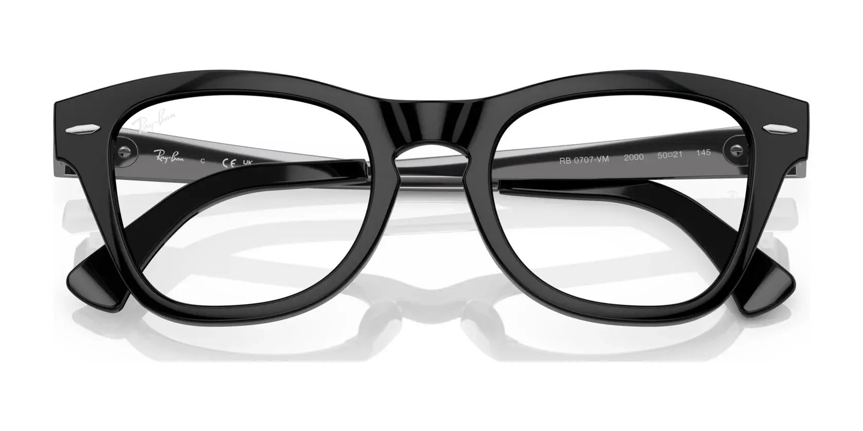 The Ray-Ban RX0707VM Eyeglasses feature black rectangular frames with thick rims and clear lenses, highlighting the classic design and durability Ray-Ban is known for. Viewed from the front. The Ray-Ban RX0707VM Eyeglasses feature black rectangular frames with thick rims and clear lenses, highlighting the classic design and durability Ray-Ban is known for. Viewed from the front.