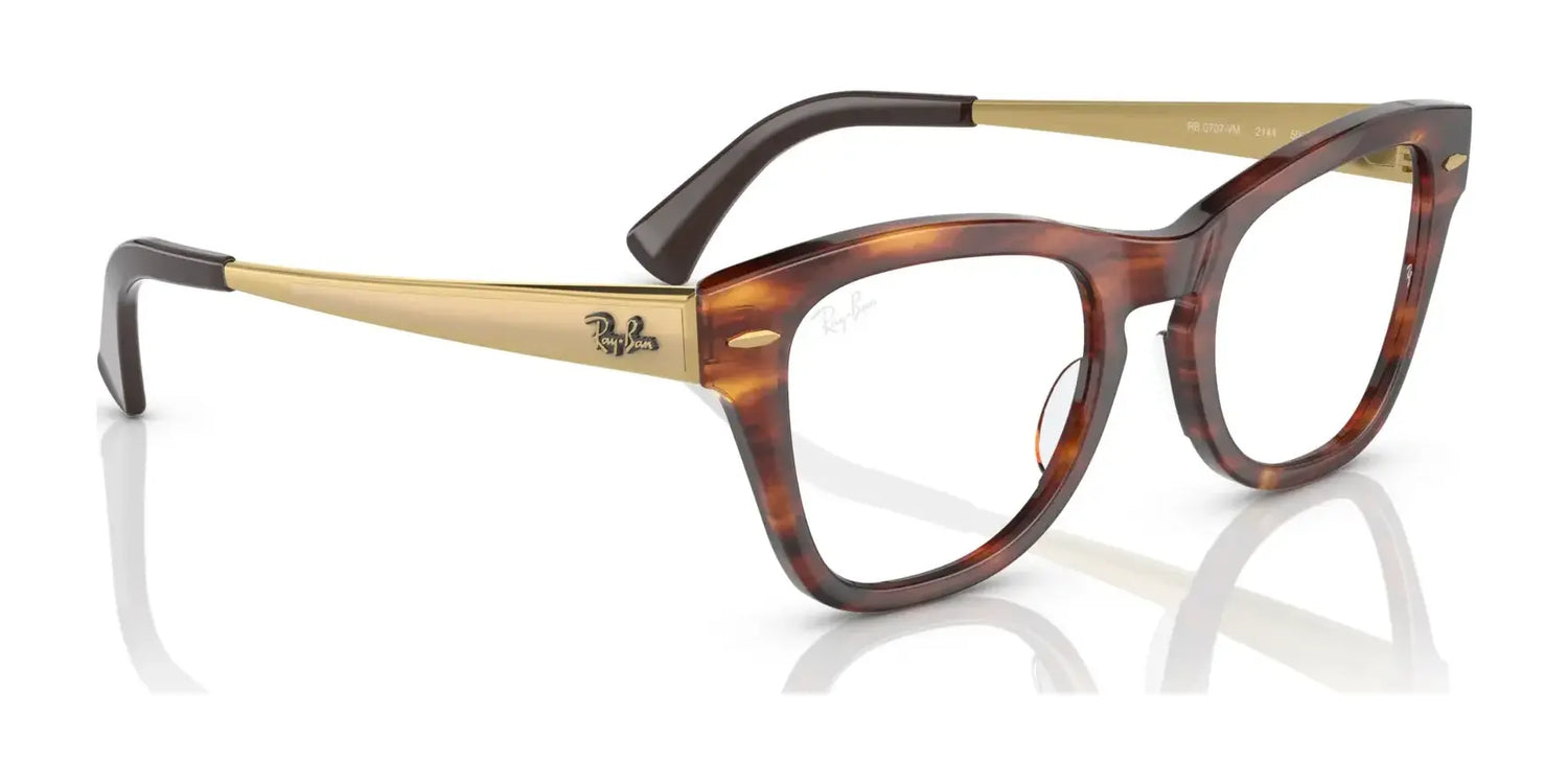 The Ray-Ban RX0707VM eyeglasses feature a tortoise-shell and gold design that exudes an iconic style with a sleek finish, highlighted by the signature Ray-Ban logo on the side. The Ray-Ban RX0707VM eyeglasses feature a tortoise-shell and gold design that exudes an iconic style with a sleek finish, highlighted by the signature Ray-Ban logo on the side.