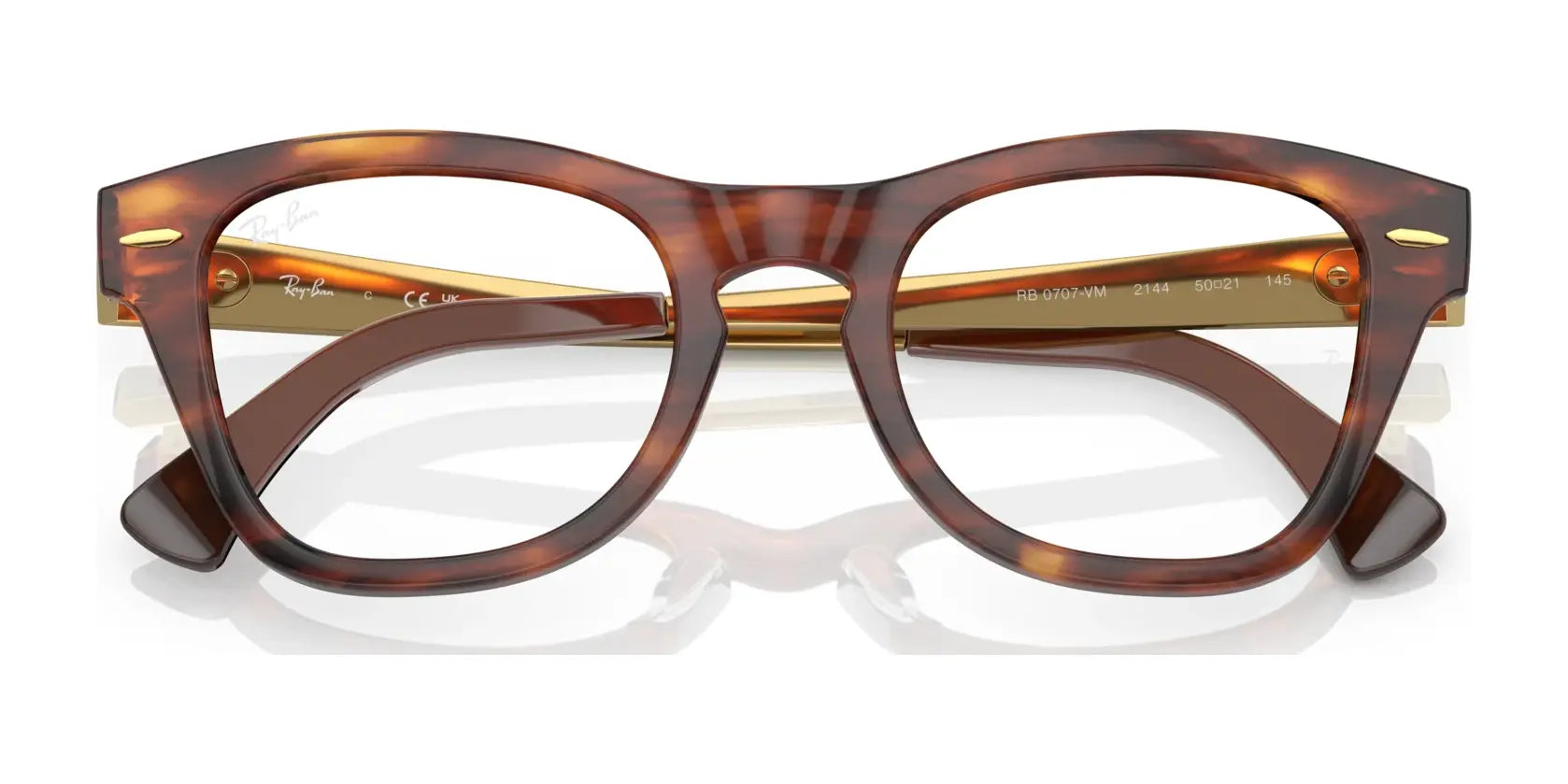 Ray-Ban RX0707VM Eyeglasses showcasing an iconic design with tortoiseshell square frames and transparent lenses, viewed from the front. Ray-Ban RX0707VM Eyeglasses showcasing an iconic design with tortoiseshell square frames and transparent lenses, viewed from the front.