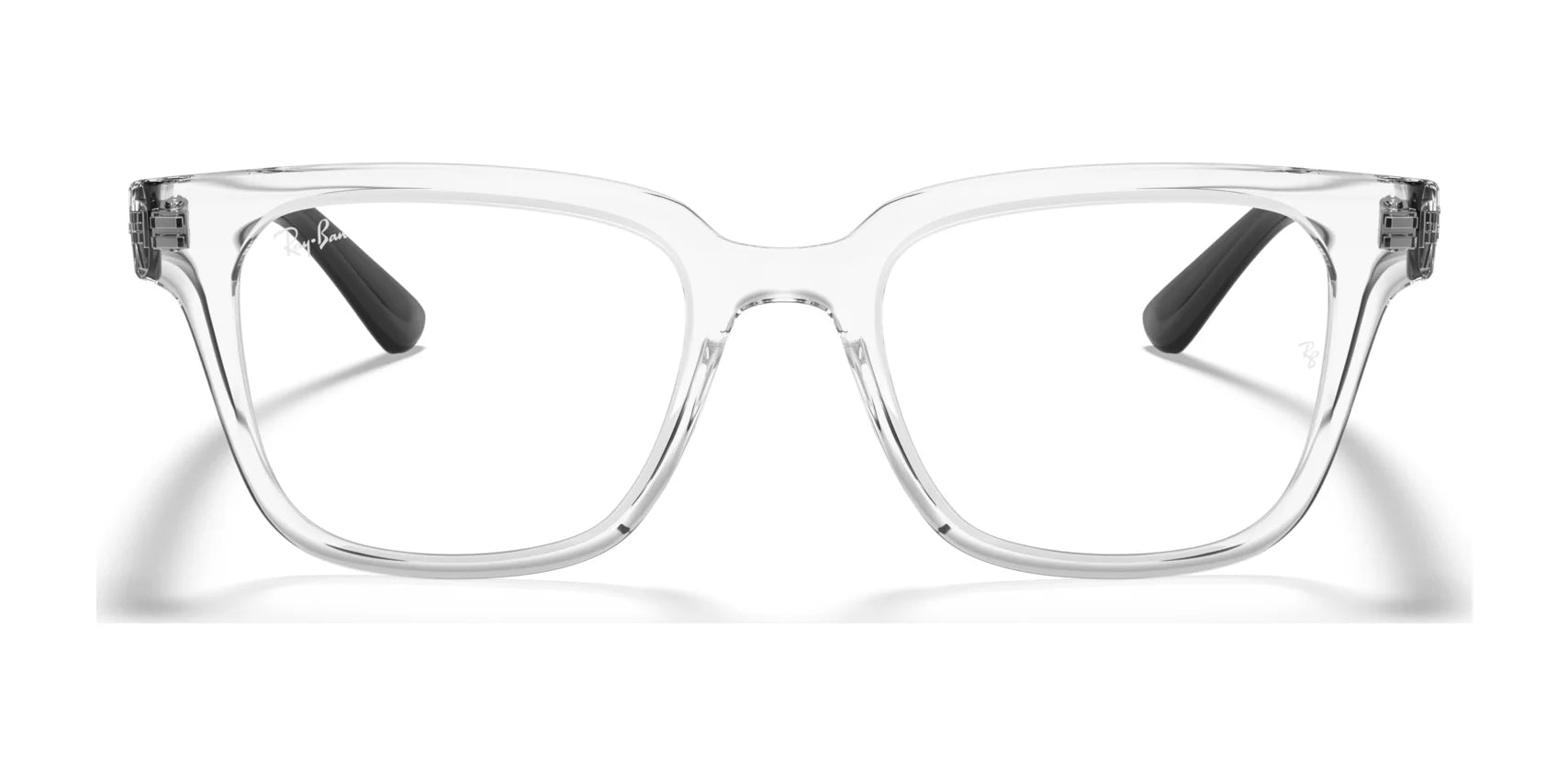 The Ray-Ban RX4323V Eyeglasses in Size 51 feature clear square frames with prescription-ready lenses and sleek black temple tips, showcased head-on against a white background to highlight their modern twist on a classic style. The Ray-Ban RX4323V Eyeglasses in Size 51 feature clear square frames with prescription-ready lenses and sleek black temple tips, showcased head-on against a white background to highlight their modern twist on a classic style.