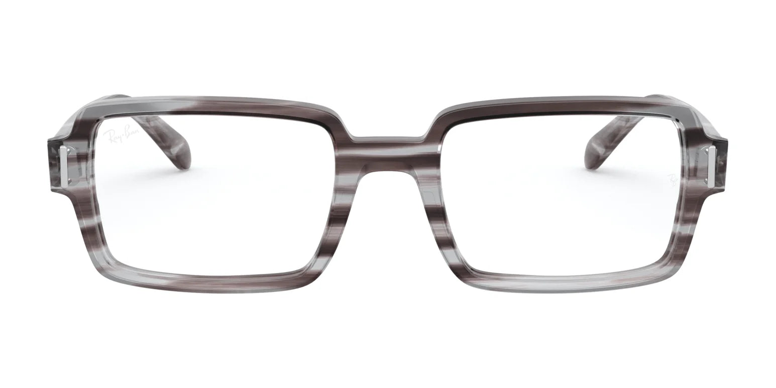 Ray-Ban BENJI RX5473 eyeglasses feature thick, gray, translucent rectangular frames made from premium materials, shown front-facing against a white background. Ray-Ban BENJI RX5473 eyeglasses feature thick, gray, translucent rectangular frames made from premium materials, shown front-facing against a white background.