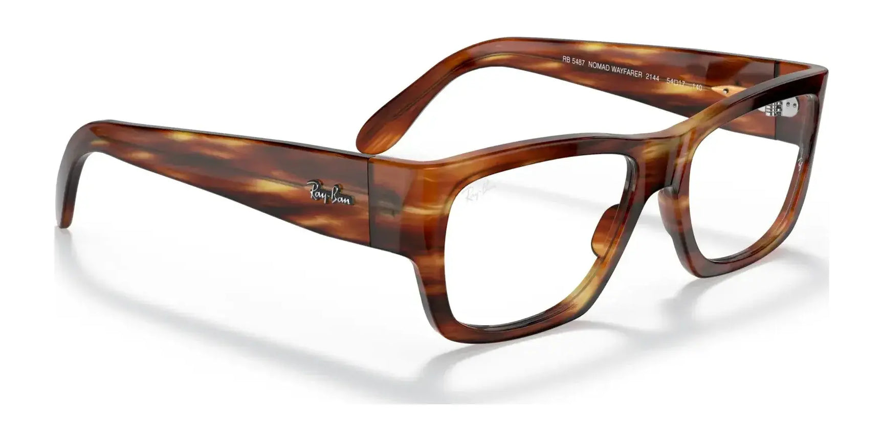 Ray-Ban NOMAD WAYFARER RX5487 eyeglasses, featuring a tortoiseshell square design with transparent lenses that highlight the fashionable acetate frame and temples. These stylish glasses are prescription ready, providing a chic look akin to classic Ray-Ban Wayfarer eyewear. Ray-Ban NOMAD WAYFARER RX5487 eyeglasses, featuring a tortoiseshell square design with transparent lenses that highlight the fashionable acetate frame and temples. These stylish glasses are prescription ready, providing a chic look akin to classic Ray-Ban Wayfarer eyewear.