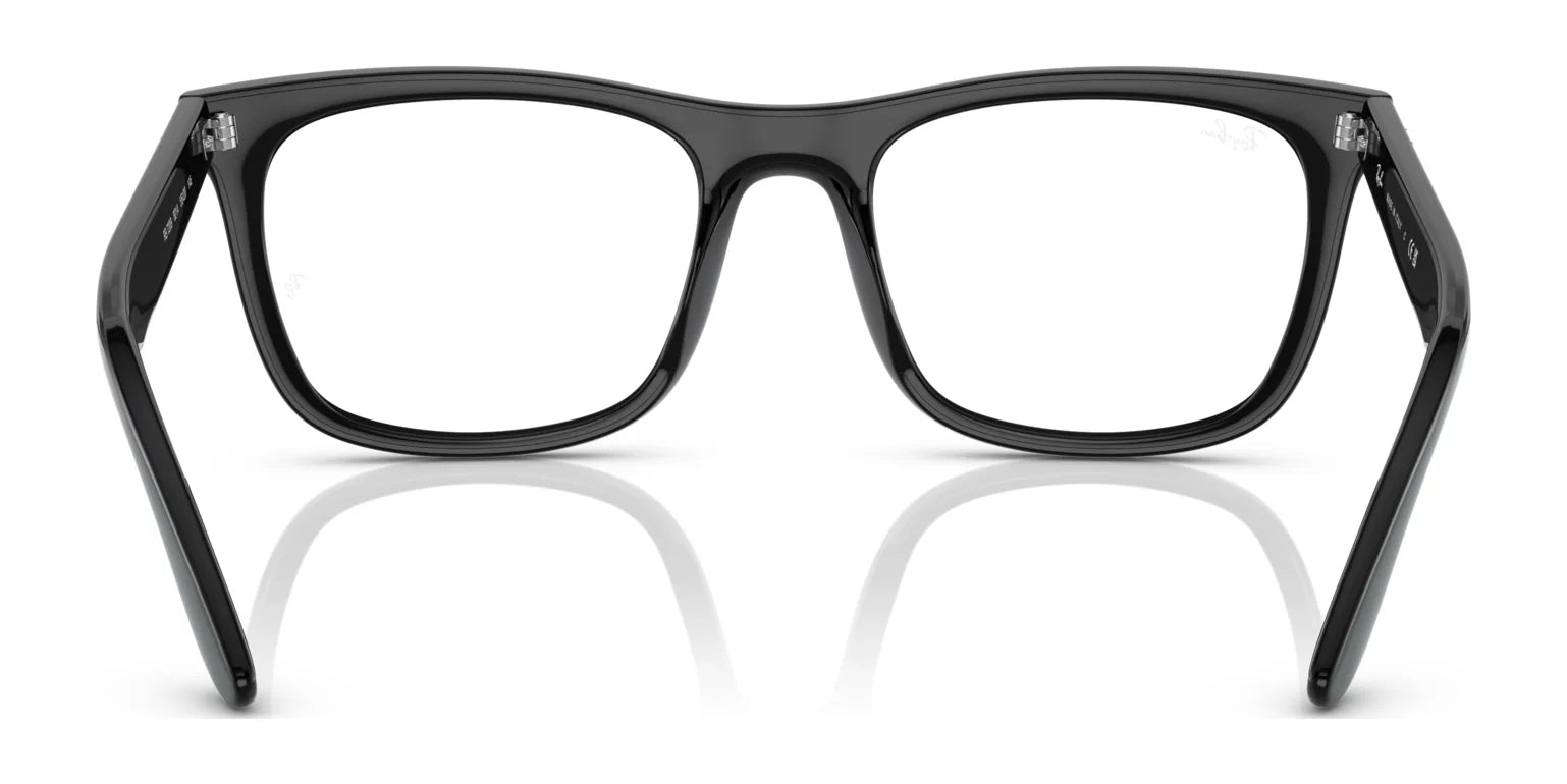 The Ray-Ban RX7209 Eyeglasses | Size 55 feature a pair of black rectangular frames with thick edges set against a white background, providing a luxurious touch to your eyewear collection. With a perfect balance of style and function, these prescription-ready glasses from Ray-Ban offer convenient sophistication. The Ray-Ban RX7209 Eyeglasses | Size 55 feature a pair of black rectangular frames with thick edges set against a white background, providing a luxurious touch to your eyewear collection. With a perfect balance of style and function, these prescription-ready glasses from Ray-Ban offer convenient sophistication.