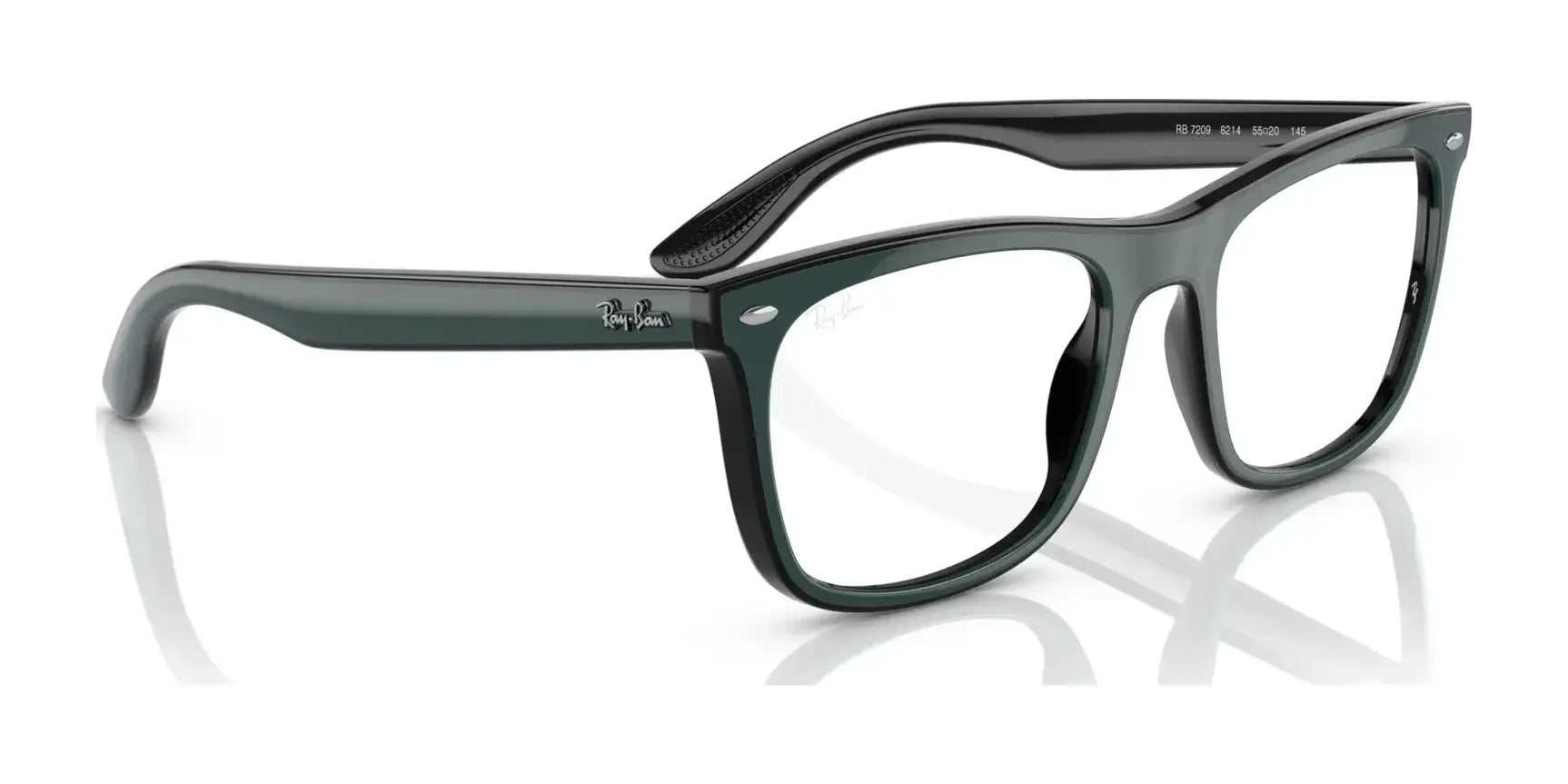 Enhance your eyewear collection with the luxurious Ray-Ban RX7209 eyeglasses in black, featuring a classic Wayfarer style and transparent lenses. Angled perfectly against a white background, these glasses combine iconic design with practical functionality and are prescription ready for your convenience. Enhance your eyewear collection with the luxurious Ray-Ban RX7209 eyeglasses in black, featuring a classic Wayfarer style and transparent lenses. Angled perfectly against a white background, these glasses combine iconic design with practical functionality and are prescription ready for your convenience.