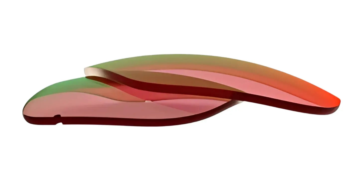 Two curved, translucent RE Ranger Classic Lenses by RE Ranger, each with a gradient tint, overlap on a white background. Two curved, translucent RE Ranger Classic Lenses by RE Ranger, each with a gradient tint, overlap on a white background.