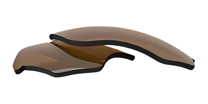 Two curved, brown-tinted RE Ranger Phoenix Sport Lens replacements by RE Ranger on a white background, designed to provide clear vision during your activities. Two curved, brown-tinted RE Ranger Phoenix Sport Lens replacements by RE Ranger on a white background, designed to provide clear vision during your activities.