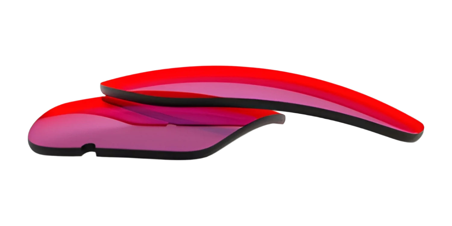 Two curved RE Ranger XLW lenses, tinted red, are stacked on a white background. Two curved RE Ranger XLW lenses, tinted red, are stacked on a white background.
