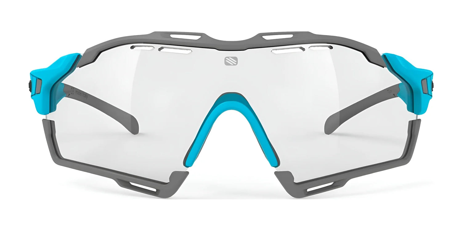 Rudy Project Cutline Sunglasses by Rudy Project feature clear, prescription-ready lenses, a gray frame, and blue accents on the nose bridge and sides, shown from the front. Rudy Project Cutline Sunglasses by Rudy Project feature clear, prescription-ready lenses, a gray frame, and blue accents on the nose bridge and sides, shown from the front.