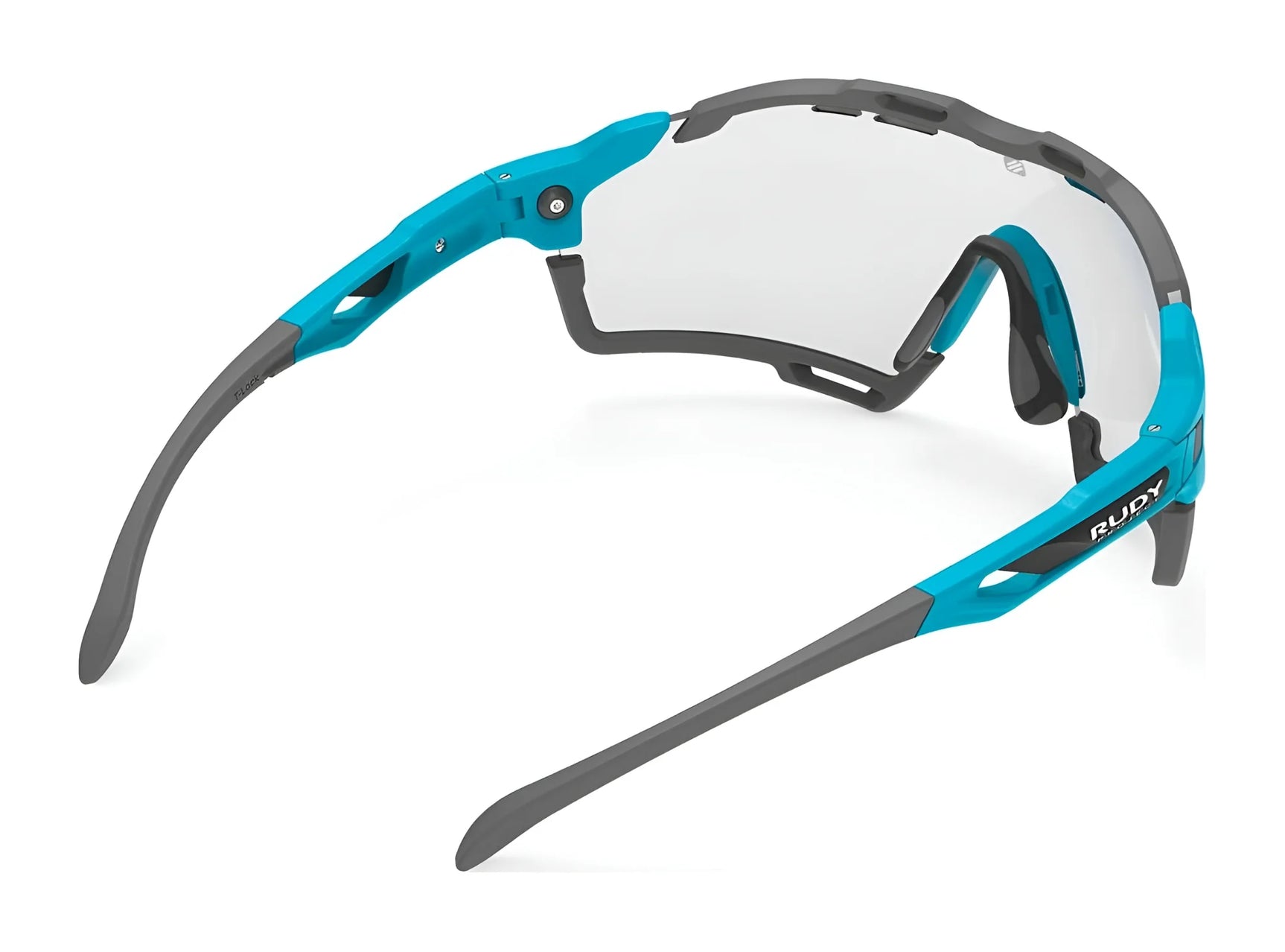 The Rudy Project Cutline Sunglasses by Rudy Project, shown from the rear against a white background, feature blue and gray frames, clear interchangeable lenses, and adaptive temple tips. The Rudy Project Cutline Sunglasses by Rudy Project, shown from the rear against a white background, feature blue and gray frames, clear interchangeable lenses, and adaptive temple tips.