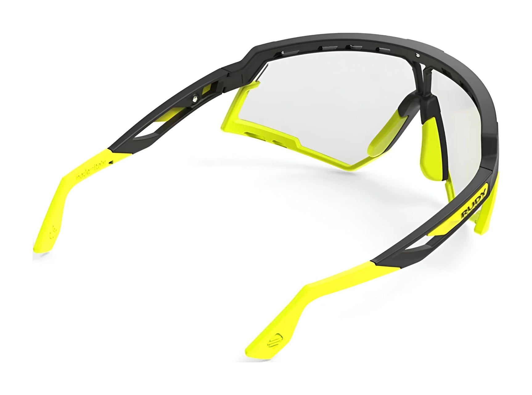 Rudy Project Defender Sunglasses | Size 141 by Rudy Project in yellow and black, featuring clear interchangeable lenses, shown from a rear, angled view. Rudy Project Defender Sunglasses | Size 141 by Rudy Project in yellow and black, featuring clear interchangeable lenses, shown from a rear, angled view.