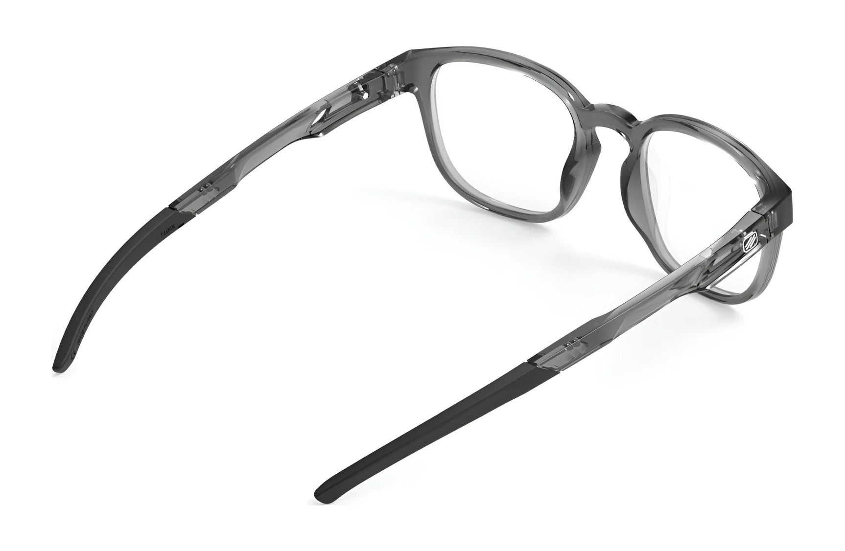 Rudy Project Iridis 66 Eyeglasses | Size 51 feature a durable translucent gray Grilamid frame with black temple arms, shown from the rear on a white background—ideal for sports and daily wear. Rudy Project Iridis 66 Eyeglasses | Size 51 feature a durable translucent gray Grilamid frame with black temple arms, shown from the rear on a white background—ideal for sports and daily wear.