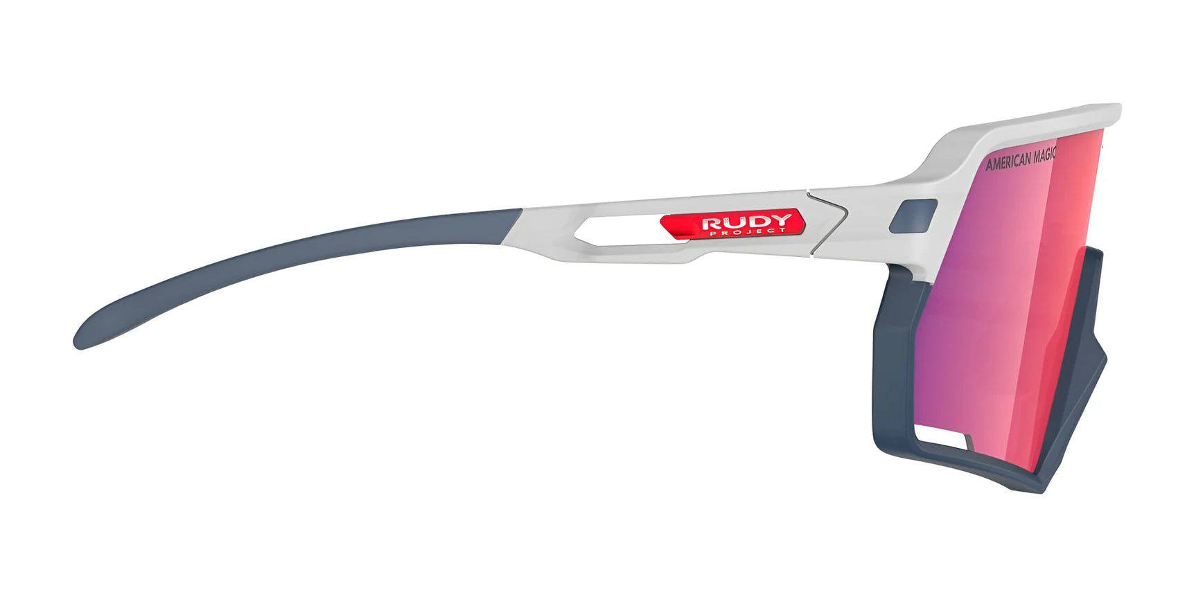 Side view of Rudy Project Kelion Sunglasses | Size 144, featuring red-tinted interchangeable lenses, a gray and white frame with the Rudy Project logo, and excellent UV protection. Side view of Rudy Project Kelion Sunglasses | Size 144, featuring red-tinted interchangeable lenses, a gray and white frame with the Rudy Project logo, and excellent UV protection.