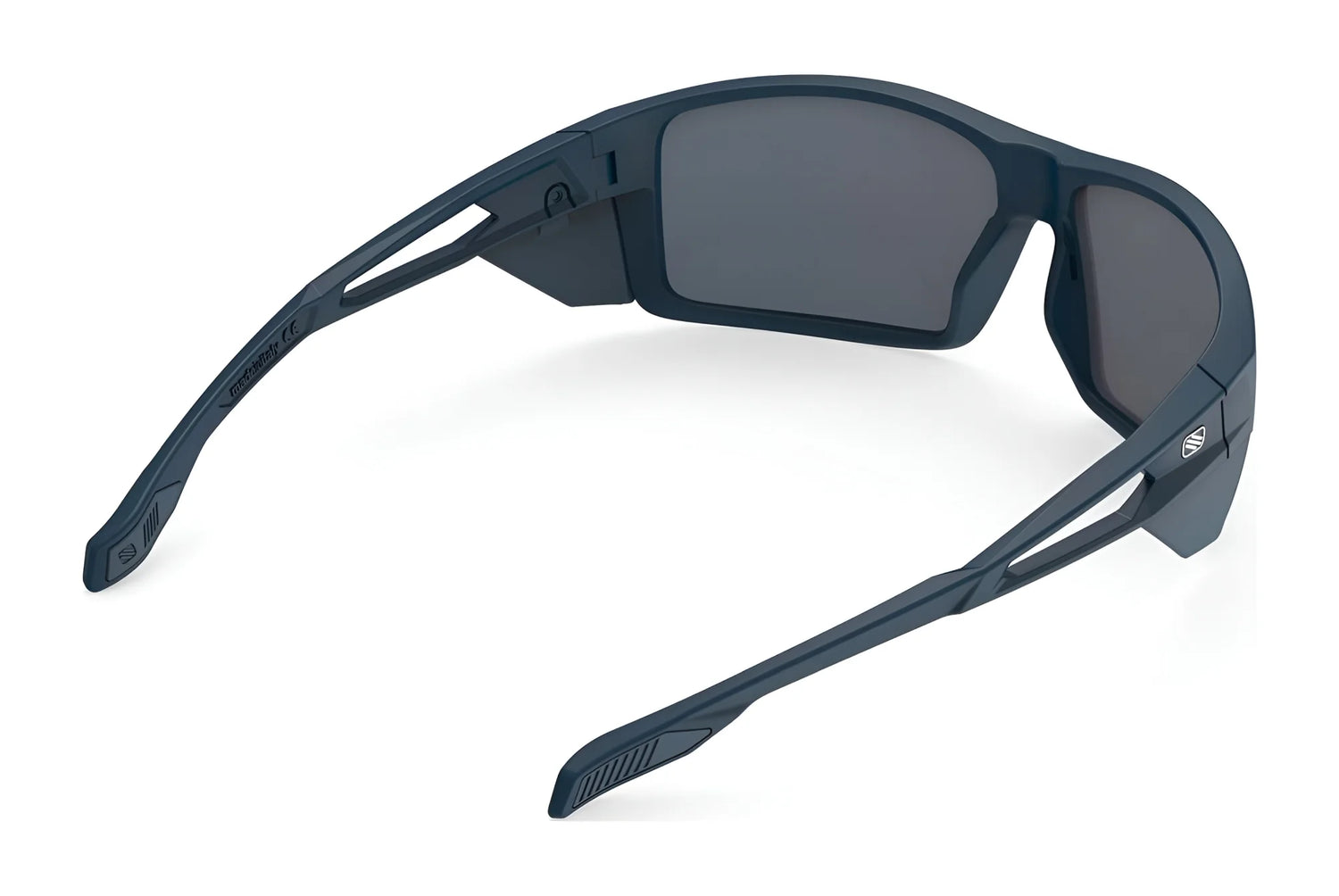 The Rudy Project Nyad Sunglasses (Size 64) feature a matte black frame, dark lenses, and thick angular arms, shown from the back. Designed by Rudy Project, these sport sunglasses offer UV protection for outdoor activities. The Rudy Project Nyad Sunglasses (Size 64) feature a matte black frame, dark lenses, and thick angular arms, shown from the back. Designed by Rudy Project, these sport sunglasses offer UV protection for outdoor activities.