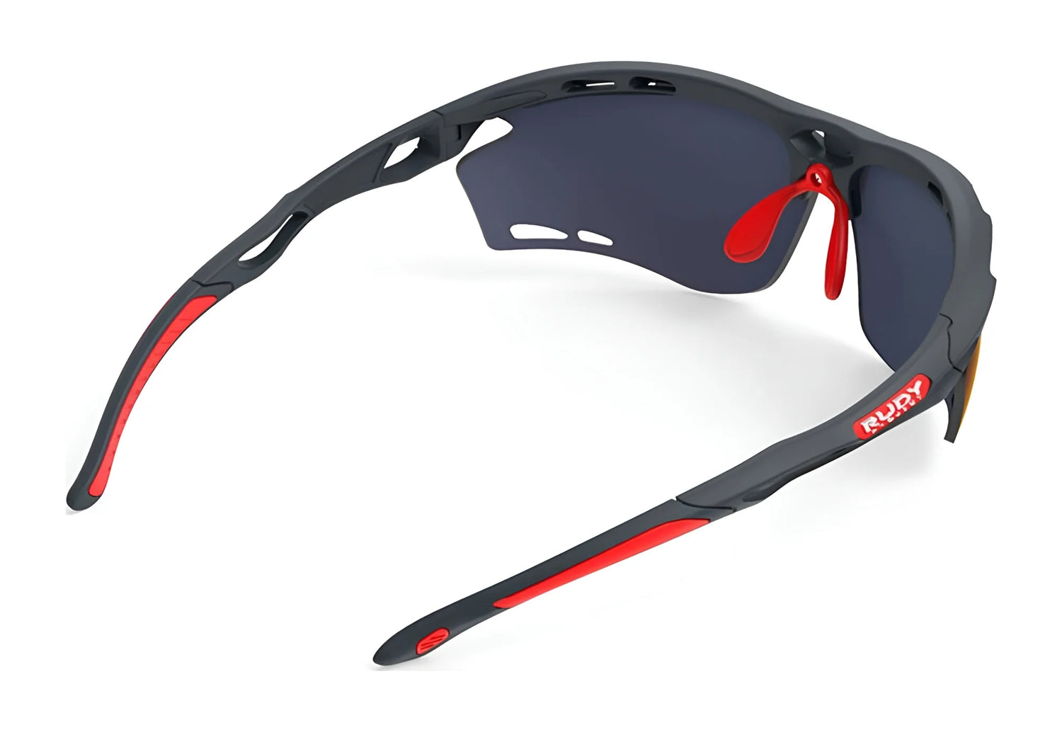 Rudy Project Propulse Sunglasses in size 75, by Rudy Project, shown from the back on a white background. These black and red sports shades feature dark UV-protective lenses and an adjustable nosepiece. Rudy Project Propulse Sunglasses in size 75, by Rudy Project, shown from the back on a white background. These black and red sports shades feature dark UV-protective lenses and an adjustable nosepiece.