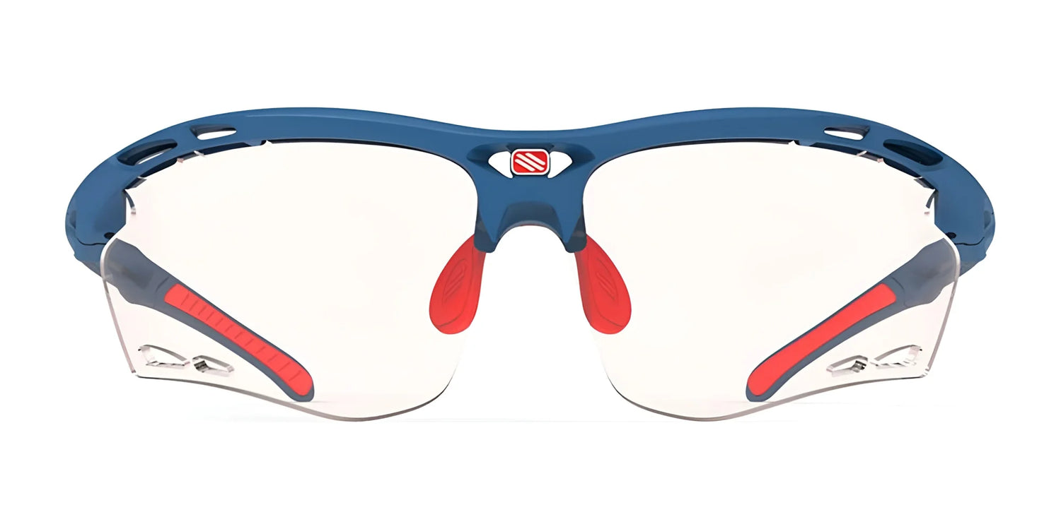The Rudy Project Propulse Sunglasses in blue and red, size 75, feature clear lenses and an adjustable nosepiece for a custom fit, displayed from the front on a white background. The Rudy Project Propulse Sunglasses in blue and red, size 75, feature clear lenses and an adjustable nosepiece for a custom fit, displayed from the front on a white background.