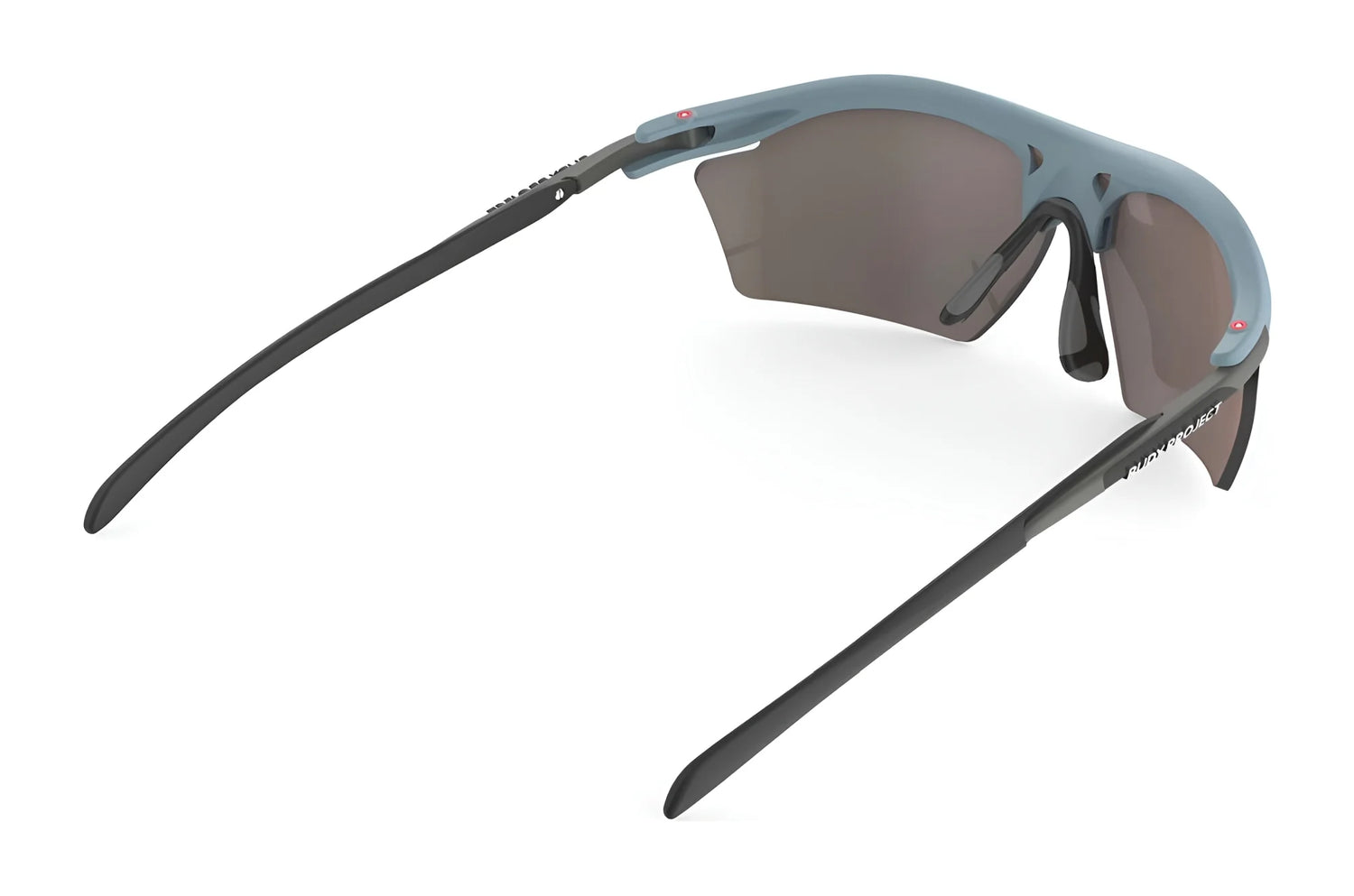 The Rudy Project Rydon Slim Sunglasses, by Rudy Project, feature an angular design with blue frames and dark lenses, viewed from the side, offering UV protection to shield your eyes from harmful rays. The Rudy Project Rydon Slim Sunglasses, by Rudy Project, feature an angular design with blue frames and dark lenses, viewed from the side, offering UV protection to shield your eyes from harmful rays.